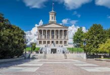 Neoclassical capitol building with central tower and steps