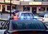 Runaway Ride Wrecks Home – Arrests Minutes Later Police car with flashing red and blue lights in a parking lot