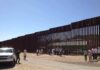 Border Flip: Deportation Reunites Families Border fence with group of people and a patrol vehicle
