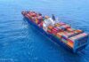 Merchant Ships Come Under Fire in Strategic Waters Container ship carrying colorful cargo containers at sea