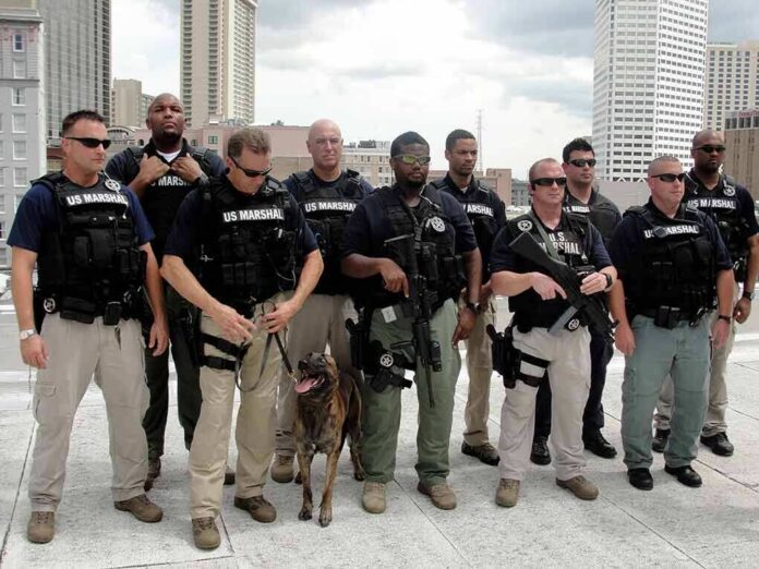 Group of law enforcement officers with tactical gear and a K9
