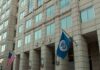 Murderers Out – Quiet ICE Blitz Stuns U.S. government building facade with American and blue departmental flags