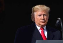 Two Lost Days, One Explosive Presidential Warning Donald Trump at a podium with a microphone