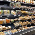 Shoppers Warned: Apple, Kiwi Contaminated Grocery store refrigerated case with prepared foods