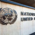 Washington Just Said No to a Pandemic Declaration United Nations emblem and signage on a concrete wall