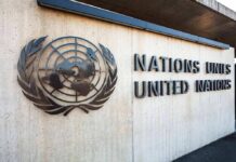 Washington Just Said No to a Pandemic Declaration United Nations emblem and signage on a concrete wall