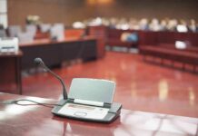 Conference microphone on a desk in a courtroom