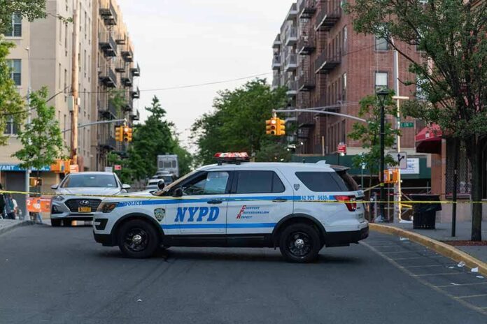 shutterstock_1976471618-1 NYPD police SUV blocking a city street at a taped-off scene