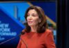 Cornell Shock: Missing Evidence Triggers Power Shift Kathy Hochul speaking at a podium with microphones