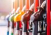 Close-up of fuel pump nozzles at a gas station