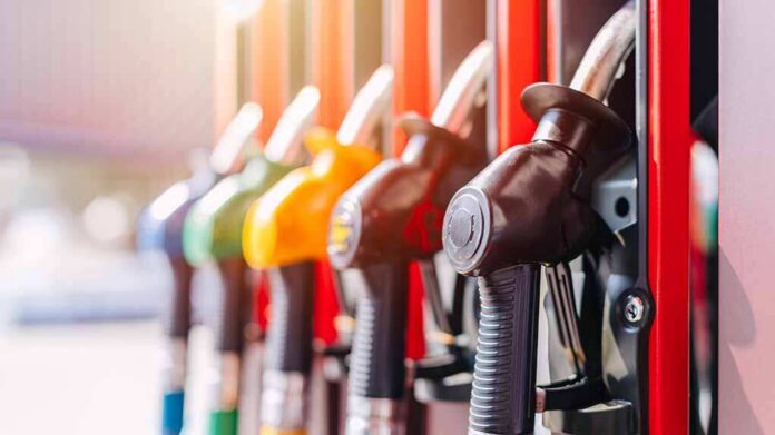 Close-up of fuel pump nozzles at a gas station