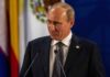 Diesel Deal Twist Freezes New Russia Tariffs Vladimir Putin at a podium during a formal event
