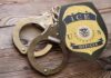 Citizenship Plea Ignored – Injured, Then Released ICE officer badge and handcuffs on wooden surface