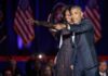 The Midterm Map Just Got an Obama Boost Michelle Obama and Rob Nabors pointing on stage at an event