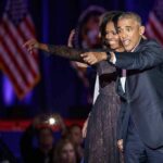 The Midterm Map Just Got an Obama Boost Michelle Obama and Rob Nabors pointing on stage at an event