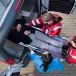 Hezbollah Bomblet? Teen Dies on Approved Trail Paramedics load a patient on a stretcher into an ambulance